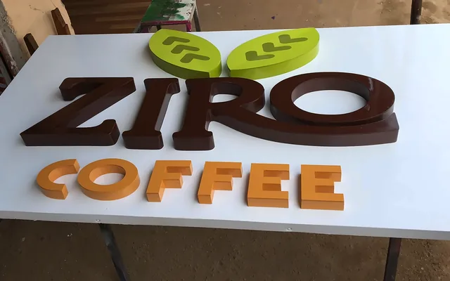 Dimensional ZIRO COFFEE letters fixed to a white panel.
